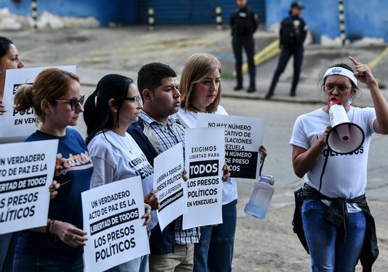 Relatives of prisoners demonstrate while waiting for the release of prisoners outside "El Rodeo" prison