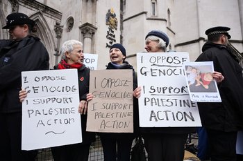 Demonstrators gather outside the High Court during a ruling on whether the government's ban of Palestine Action was unlawful on February 13, 2026 in London, United Kingdom.