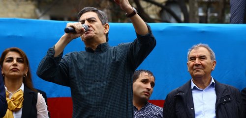 Ali Karimli speaking on stage