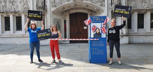 Activists outside a courtroom