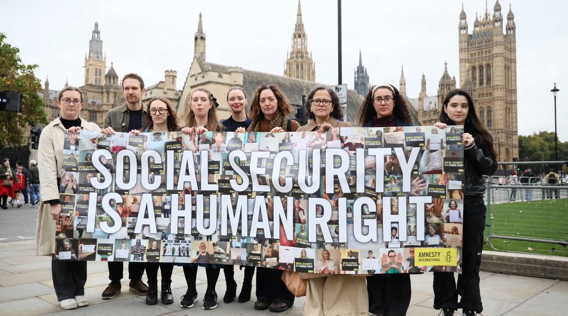 A number of protestors holding a banner that says Social Security is a human Right