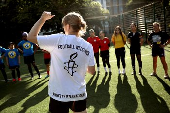 Women playing football as a part of Amnesty's Football Welcomes initiative