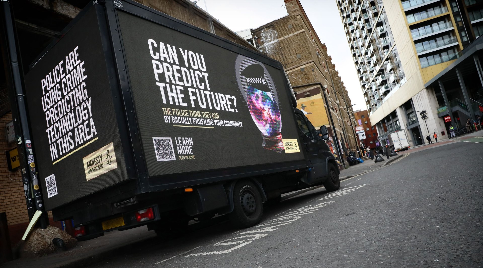 Image shows van with "Can you predict the future?" displayed