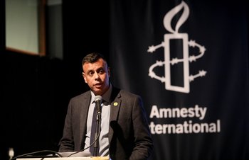 Sacha Deshmukh speaking at an Amnesty event