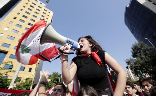 A Lebanese student taking part in an anti-government demonstration in Beirut in November 2019. Since October 2019, people in Lebanon have been calling for an end to the endemic corruption and for the ruling elites to immediately resign.