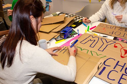 Placard making for a Women's Rights event