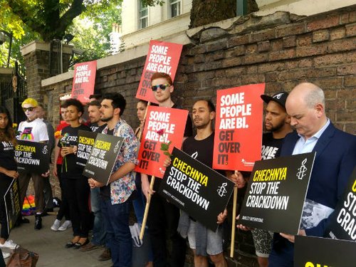 Amnesty staff standing near the Russian embassy