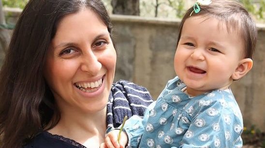 Photograph of Nazanin Zaghari-Ratcliffe smiling and holding her baby