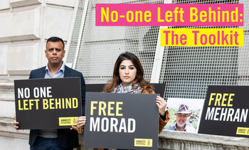Morad Tahbaz's daughter, Roxanne, protests outside with Amnesty UK's previous CEO, Sacha, holding placards saying 'Free Morad' and 'No-one Left Behind'