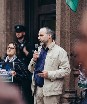 Patrick Corrigan of Amnesty International, addresses a protest outside Barclays bank in Belfast, against the genocide in Gaza