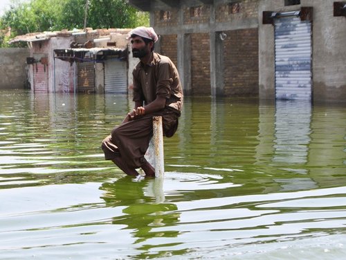 Pakistan20man20in20flood20climate20change20credit20Anadolu20Agency20via20_D0p4ySZ.jpg