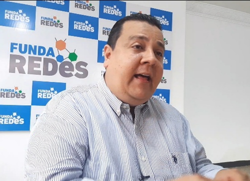 Picture of Javier Tarazona in front of a Funda Redes display.