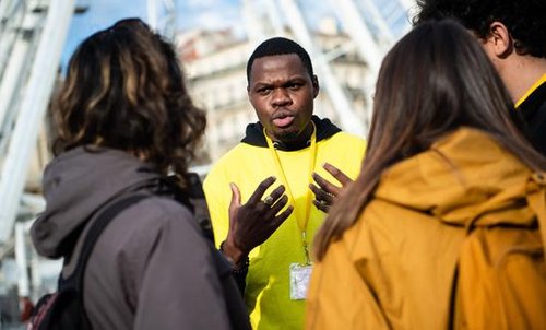 An activist speaking to a group of people
