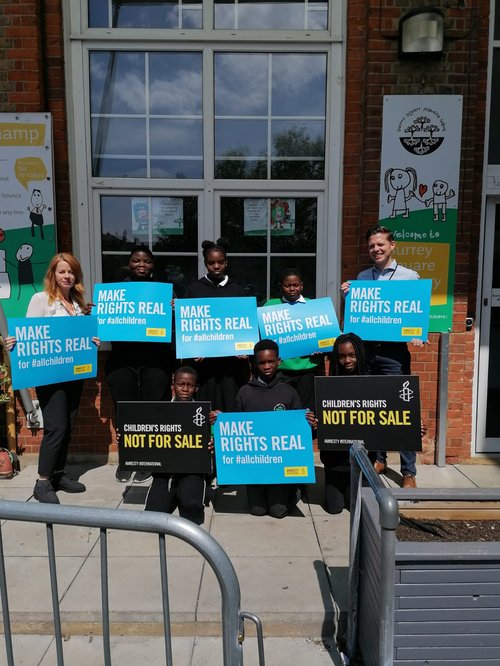 School children holding placards