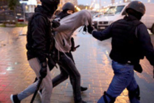 Law enforcement officers detain a man during a rally of opposition supporters to protest the country's presidential inauguration in Minsk on September 27, 2020