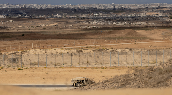 An Israeli army vehicle moves near the border with the Gaza Strip as seen from a position on the Israeli side of the border on October 29, 2025 in Southern Israel, Israel.
