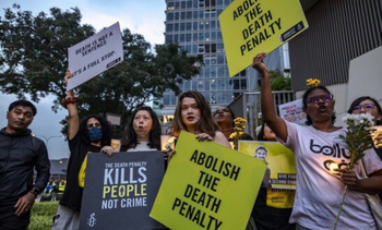 Activists attend a candlelight vigil against the impending execution of Pannir Selvam Pranthaman, sentenced to death for drug trafficking into Singapore, outside the Singaporean embassy in Kuala Lumpur, Malaysia, on February 19, 2025.