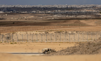 An Israeli army vehicle moves near the border with the Gaza Strip as seen from a position on the Israeli side of the border on October 29, 2025 in Southern Israel, Israel.