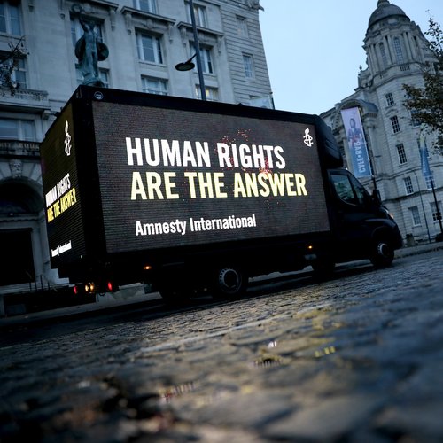 Van that reads: Human rights are the answer