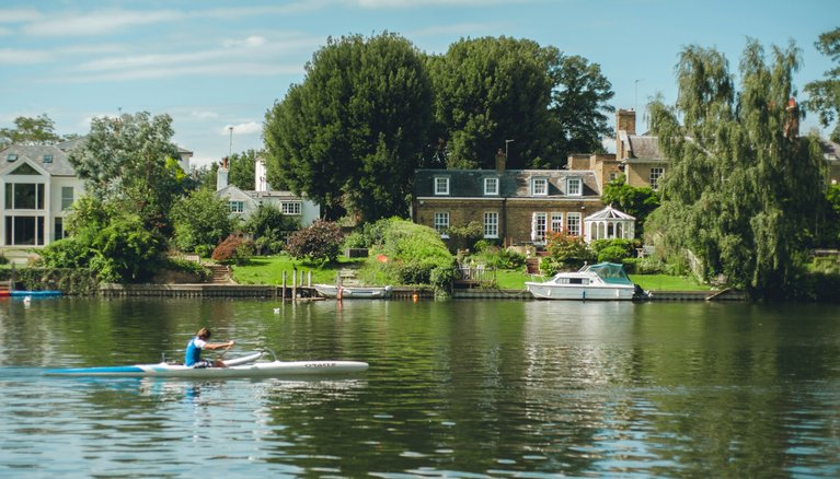 Rower training on the river Thames in summer