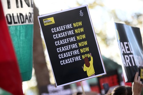 Image shows a ceasefire now sign