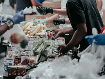 Volunteers sorting canned food donations