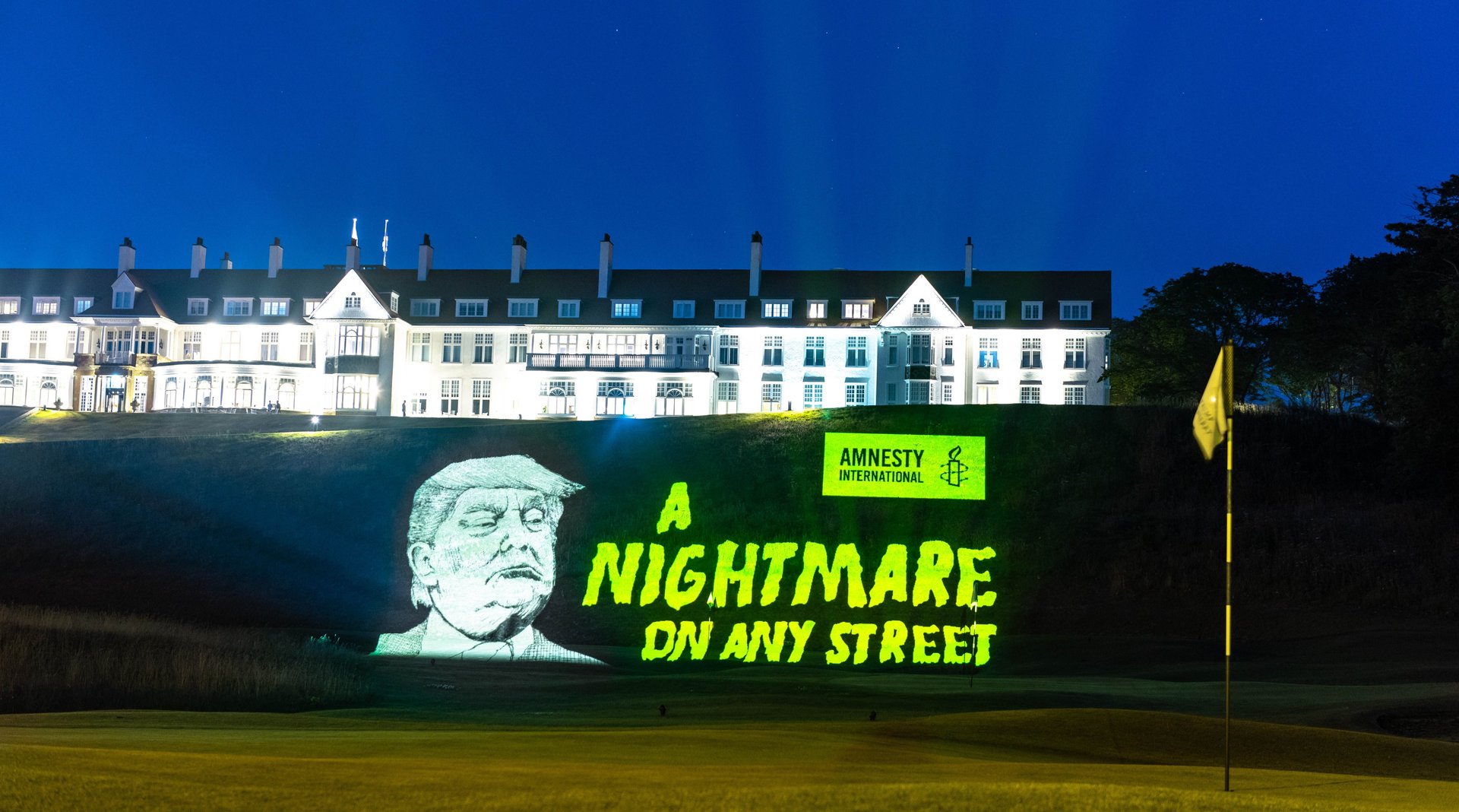An Amnesty protest banner hung at one of his golf courses depicting President Trump alongside the words 'A nightmare on any street'