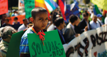 Child holding a sign up at a protest